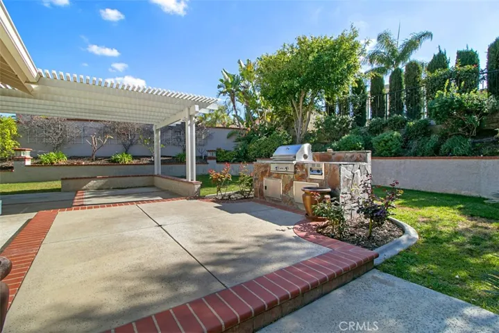 Nicely landscaped and outside BBQ