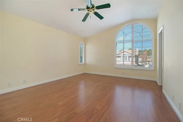 Large master with plantation shutters, ceiling fans