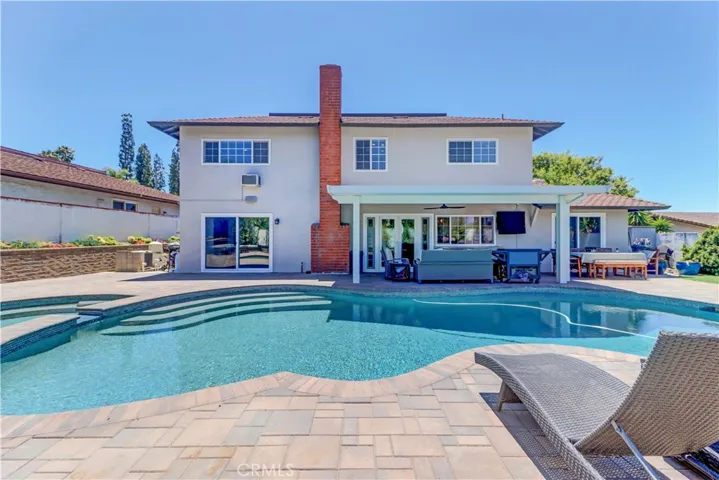 Pool home with large pool, spa and covered patio