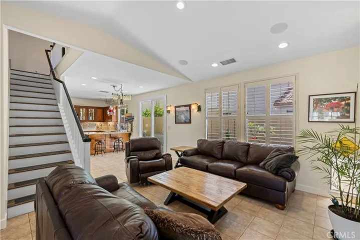 Living Room opens to kitchen and stairs to bedrooms