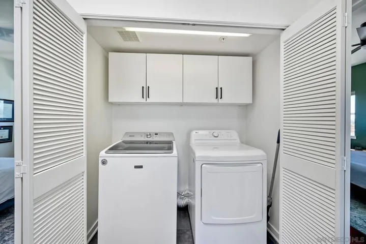 Third Level-Laundry closet. Between Primary Bedroom and non-primary bedroom. New LG Gas Dryer-2024. Full sized Washer and Dryer. Additional storage.