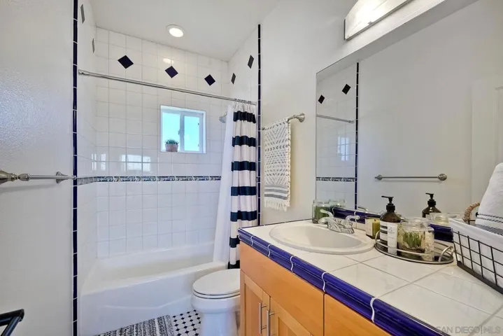 Third Level- non-primary, ensuite bathroom w/ Tube-Shower.