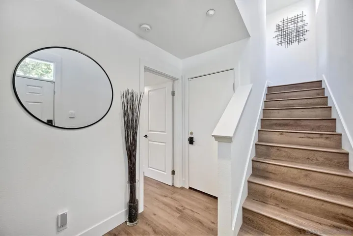 Vestibule first level. Garage access, Third bedroom, Stairs to second level.