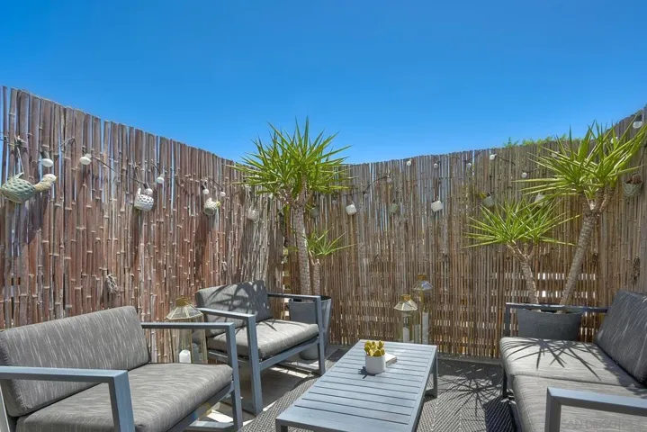 Second level balcony space. Perfect for intimate dinning. Bamboo fence provides privacy.