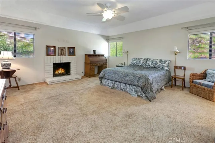 Primary bedroom with fireplace.