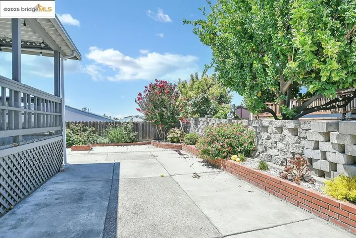Fenced backyard featuring a patio
