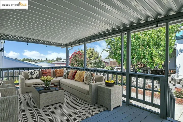 Wooden terrace featuring outdoor lounge area