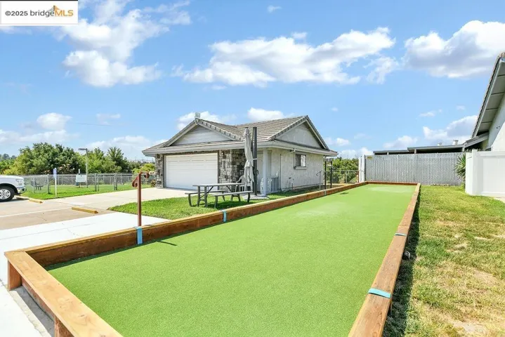 View of front of house with driveway and a garage