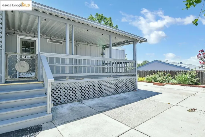 View of property exterior with a porch and board and batten siding