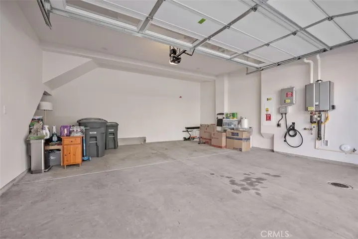 Roomy garage with tall ceilings & garage door
