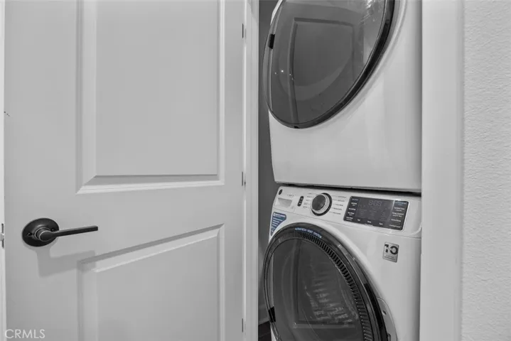 Upstairs laundry with stacked washer/dryer included