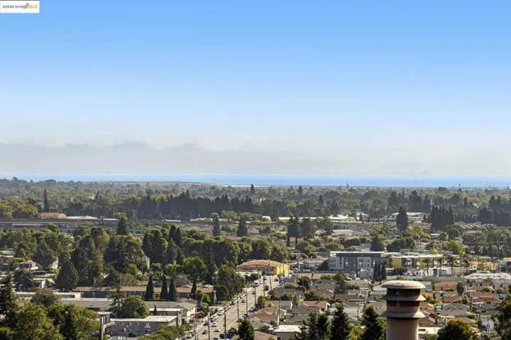 Aerial perspective of suburban area with a nearby body of water