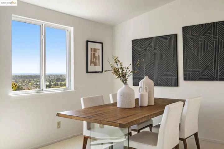 Dining space with baseboards and carpet