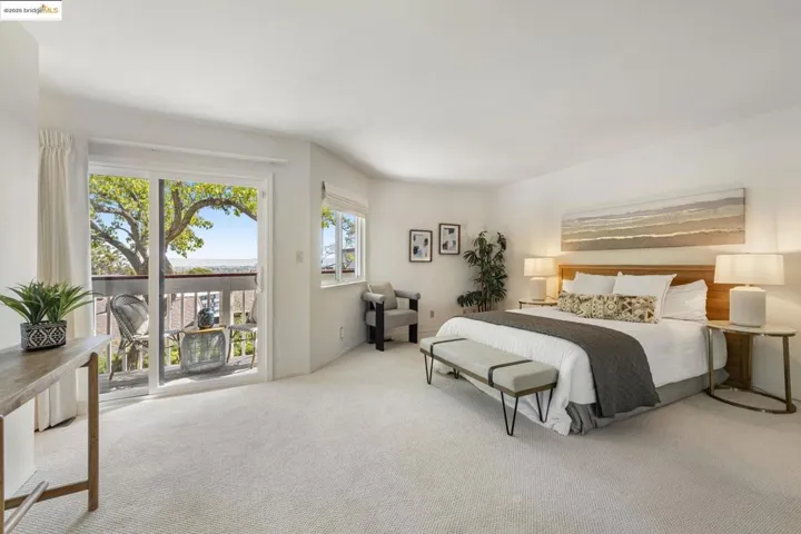 Bedroom featuring access to outside and carpet floors
