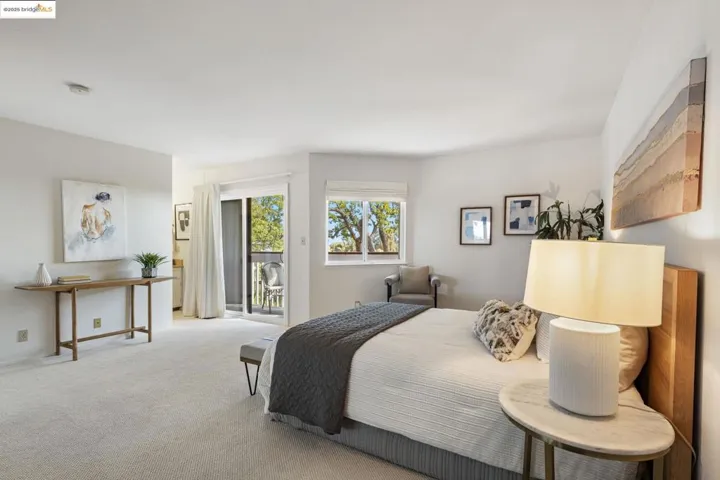 Carpeted bedroom with access to outside