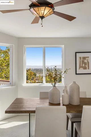 Dining area featuring ceiling fan and plenty of natural light