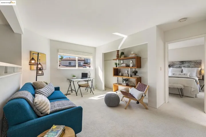 Living area with carpet floors and a desk