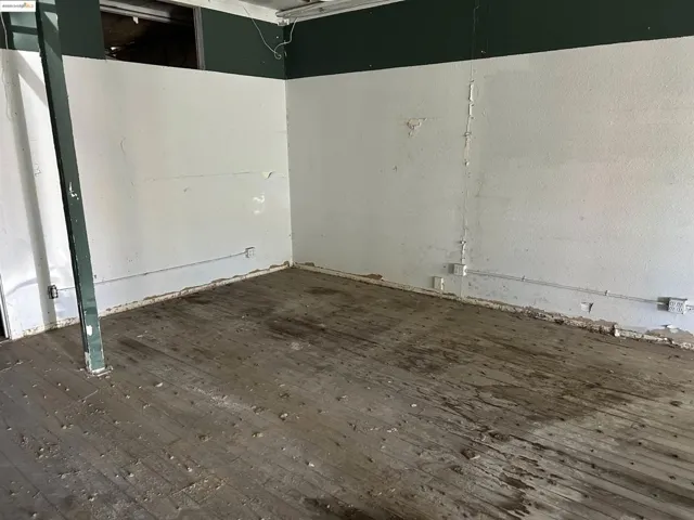 Unfurnished room featuring hardwood / wood-style flooring
