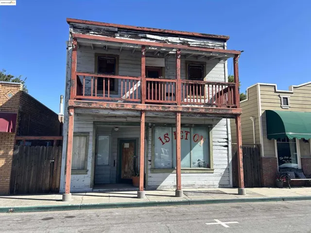 View of front of home with a balcony
