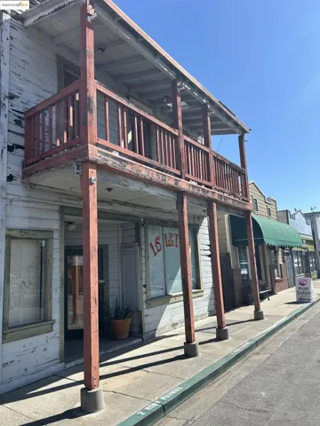 Rear view of property featuring a balcony
