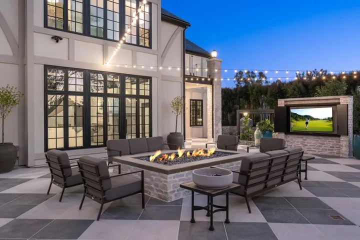 These sellers added this patio complete with oversized fire pit and outdoor TV