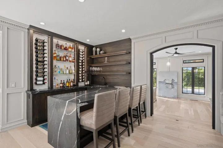 Game room, wet bar with 2 wine refrig and ice maker etc.