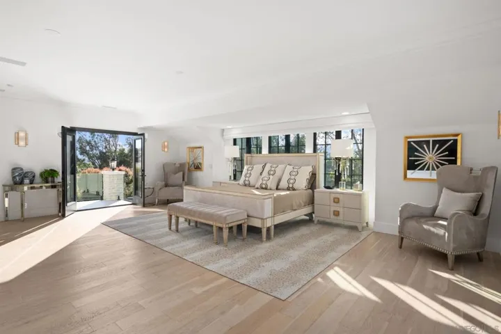 Generous, light filled primary bedroom suite with custom Her and His walk in closets and this Seller completely redid Spa Bath