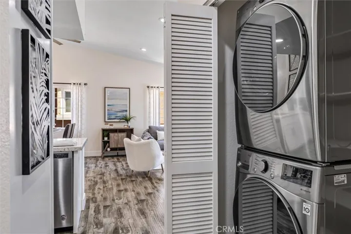 Hallway closet with Washer and Dryer and plenty of storage space.