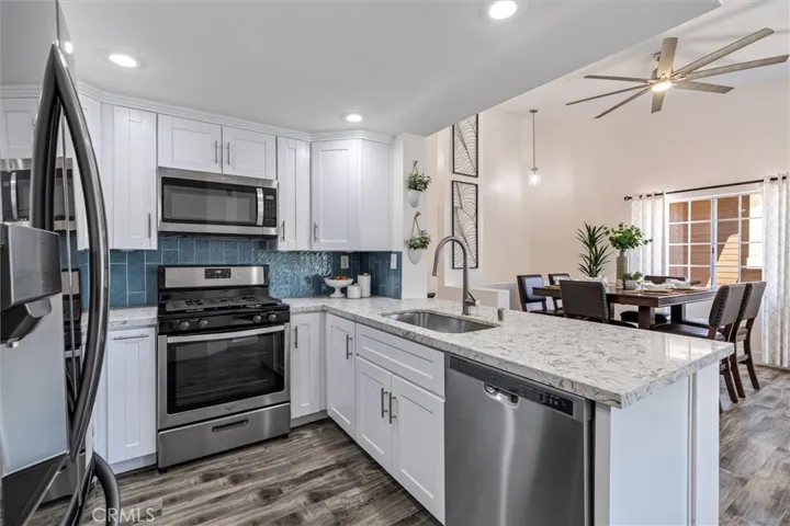 Beautifully remodeled kitchen and quartz countertops.