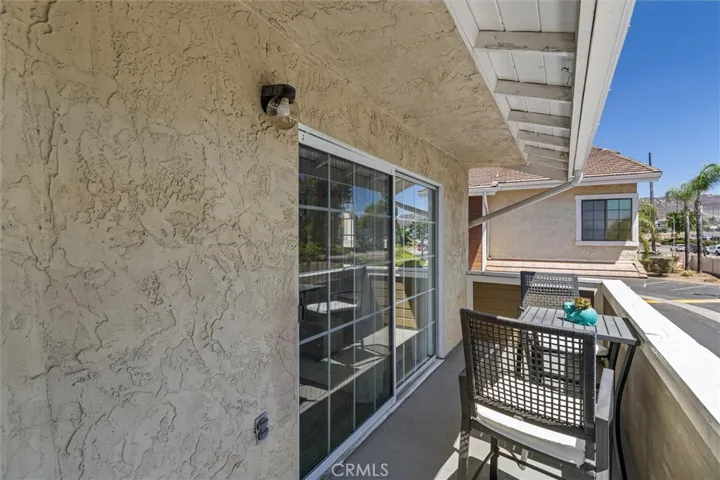 Private patio off living room, space for a grill.