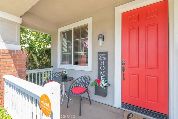 Covered entry porch with seating area