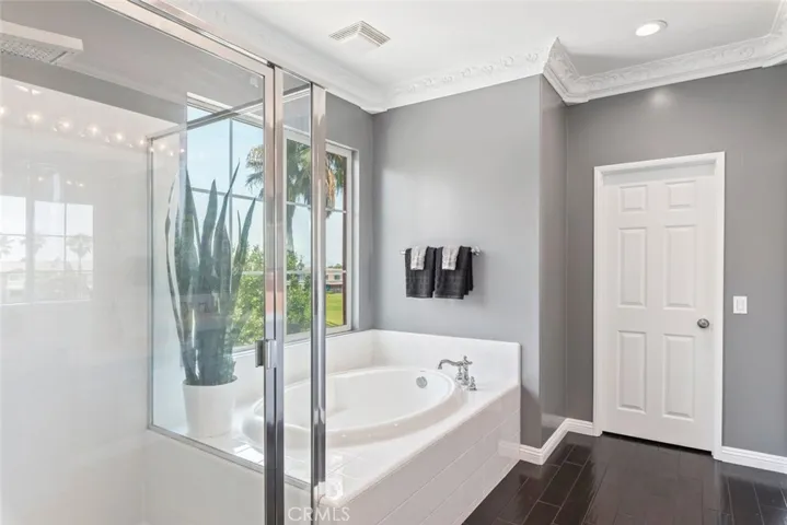 Primary bathroom with walk-in shower and tub