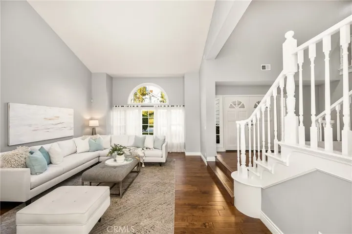 Elegant foyer opens to sun kissed formal living and dining room