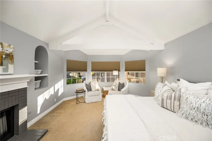 The perfect reading nook off the beamed ceiling bedroom