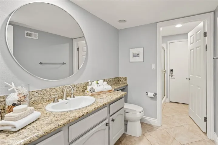First floor powder room area is separated from the walk in shower