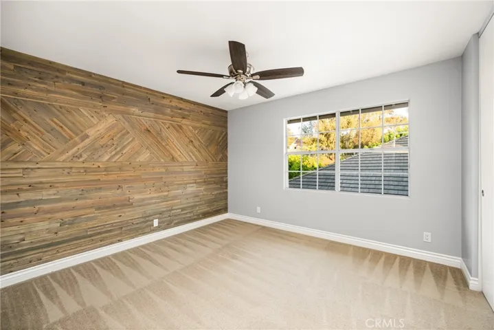 Beautiful wood wood detailed wall in the third upstairs bedroom