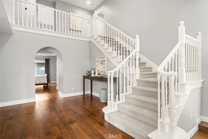 Sweeping staircase leads to the second level