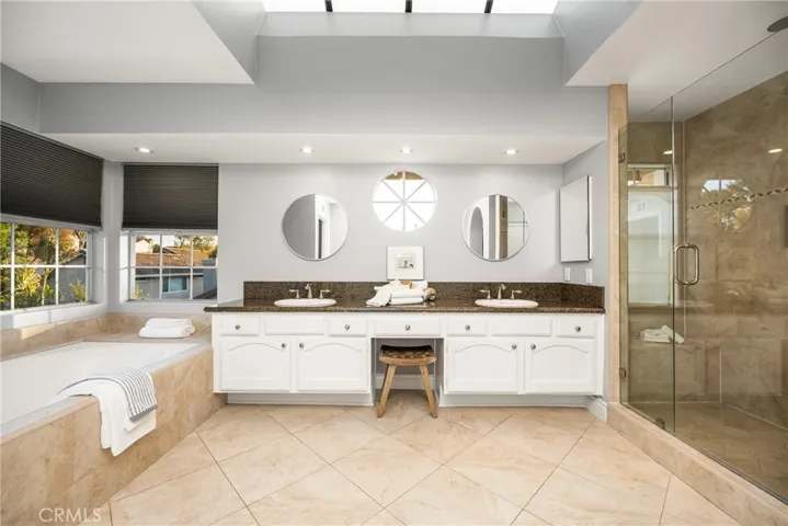 A light and bright primary ensuite with a walk in shower for two