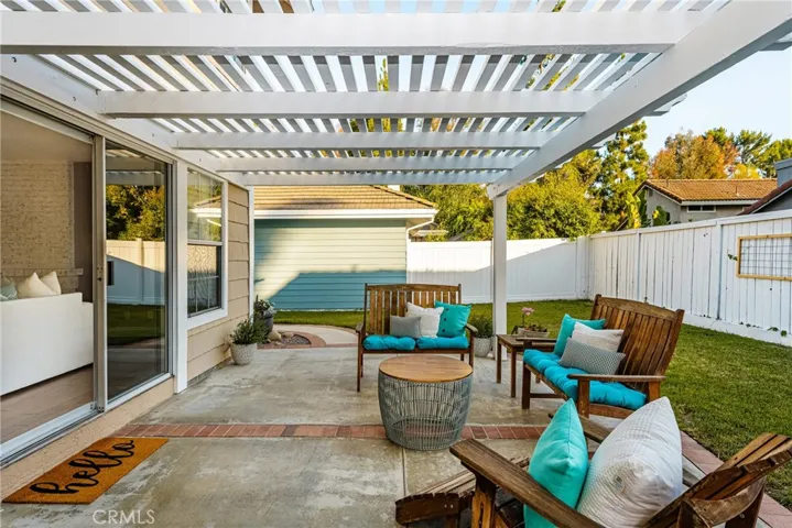 One of 4 sliding doors to the backyard leads to a spacious family room