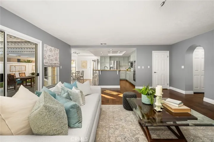 Open concept living, kitchen and dining areas