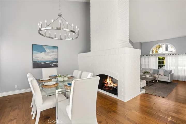 Formal dining room with peek-a-boo fireplace to formal living area