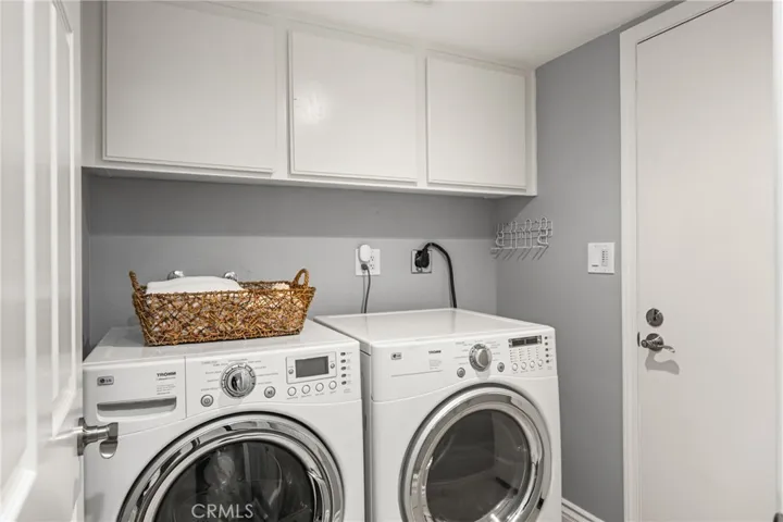 Laundry room adjacent to the 2 bay garage