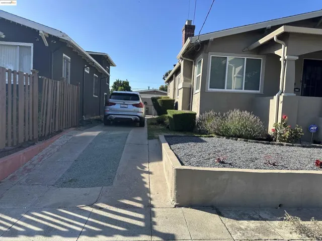 View of home's exterior with a chimney and stucco siding