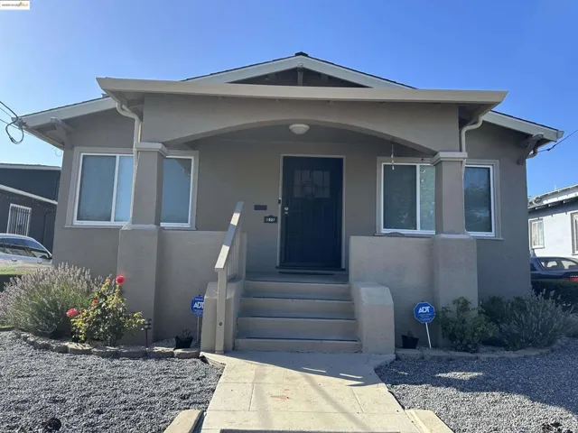 View of front of house featuring stucco siding