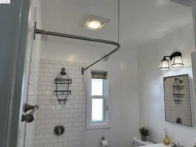 Full bathroom with toilet and a shower