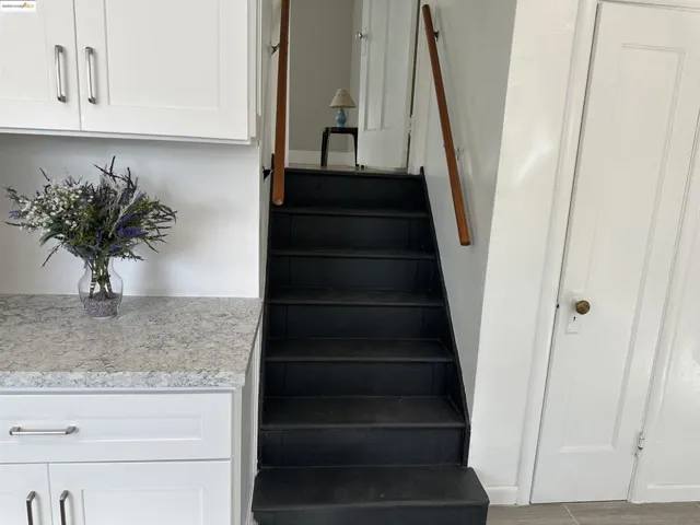 Stairway with wood finished floors