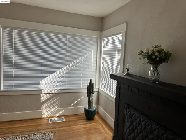 Detailed view of a textured wall and wood finished floors