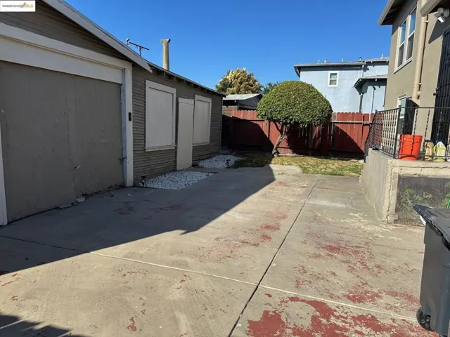 Fenced backyard featuring a patio