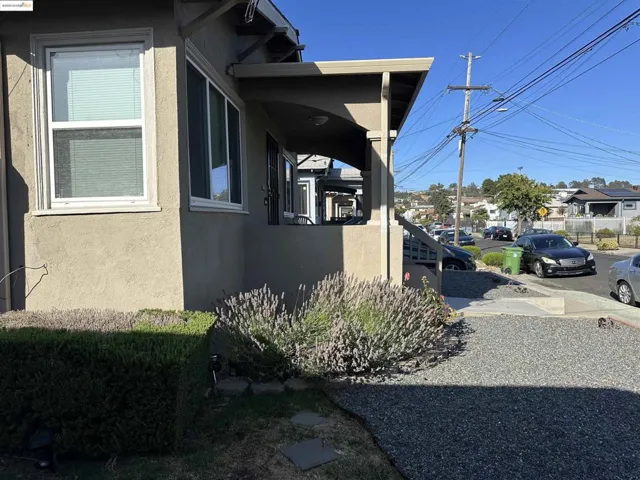 View of side of home with stucco siding