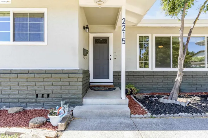 Property entrance with stucco siding